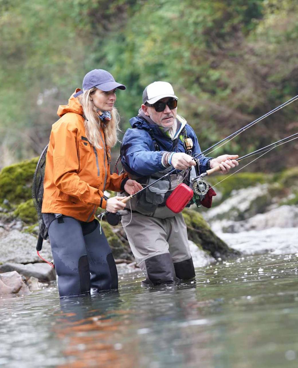 young woman learning to fly fishing with a guide